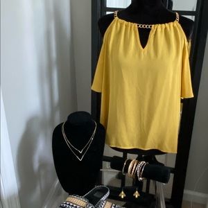 Womens peep shoulder blouse w/ a gold chain strap